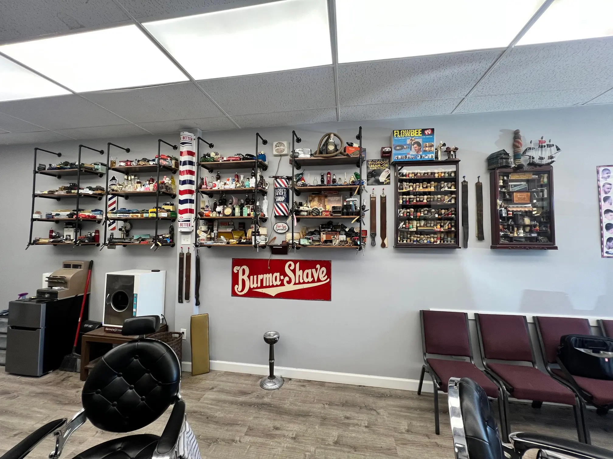 Full barbershop interior with vintage Burma-Shave sign and barber pole