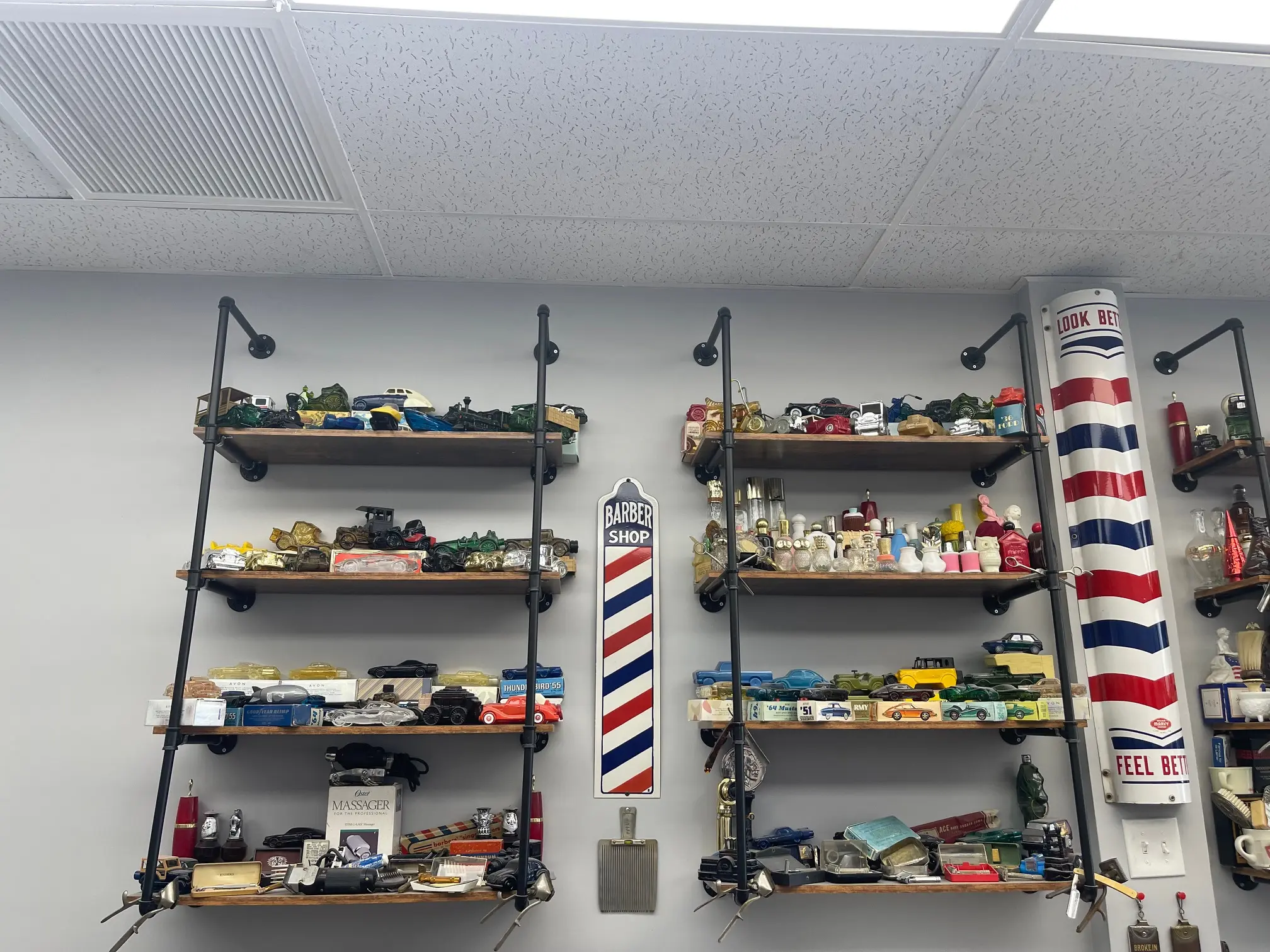 Extensive vintage car collection and barber pole display